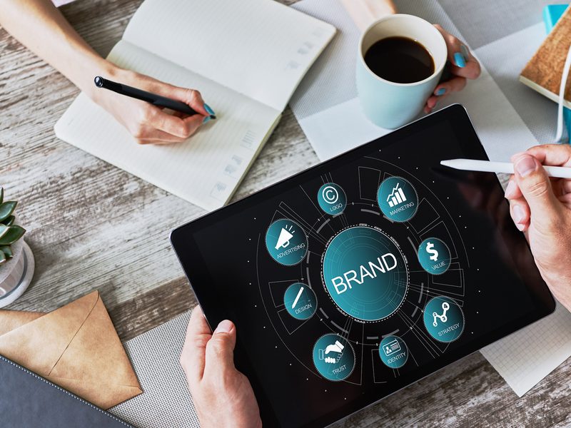 Marketing strategy and branding concepts displayed on a tablet